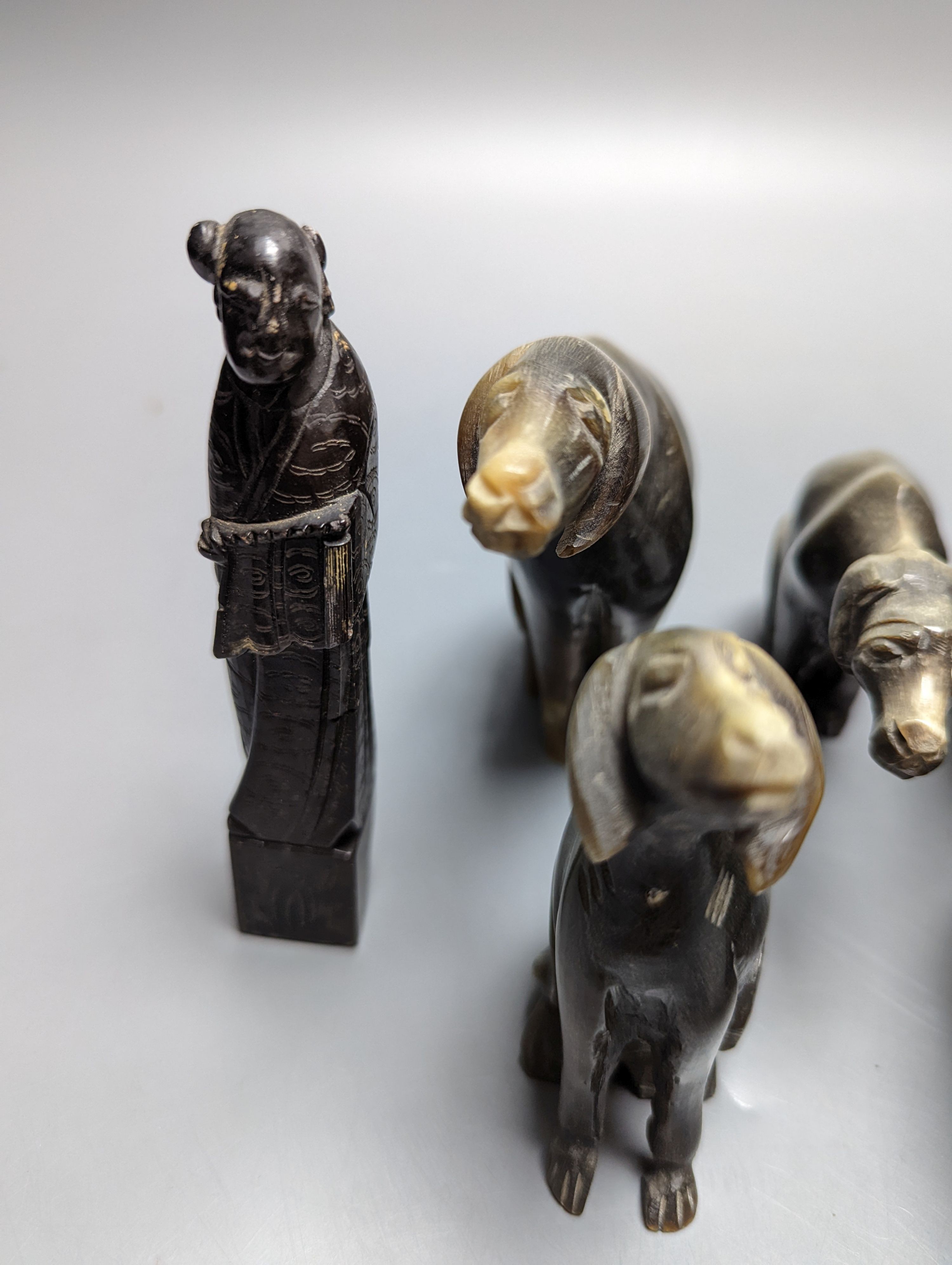 Five Chinese horn figures of dogs and two Chinese soapstone seals 12cm